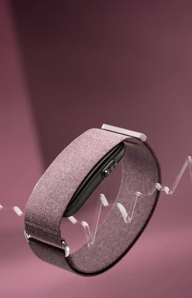 Garmin okoskarkötő prémium szövet szíjjal, amely folyamatos pulzus- és egészségfigyelést biztosít.