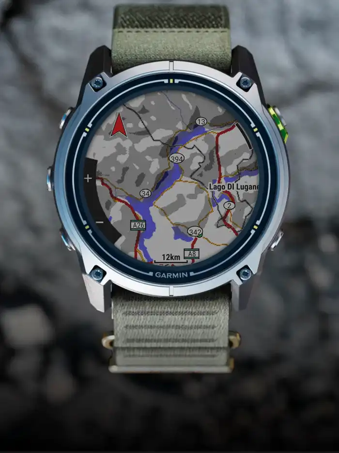 alt="Garmin Enduro 4 titanium sports watch with an olive fabric band, displaying a map of the Lake Lugano area